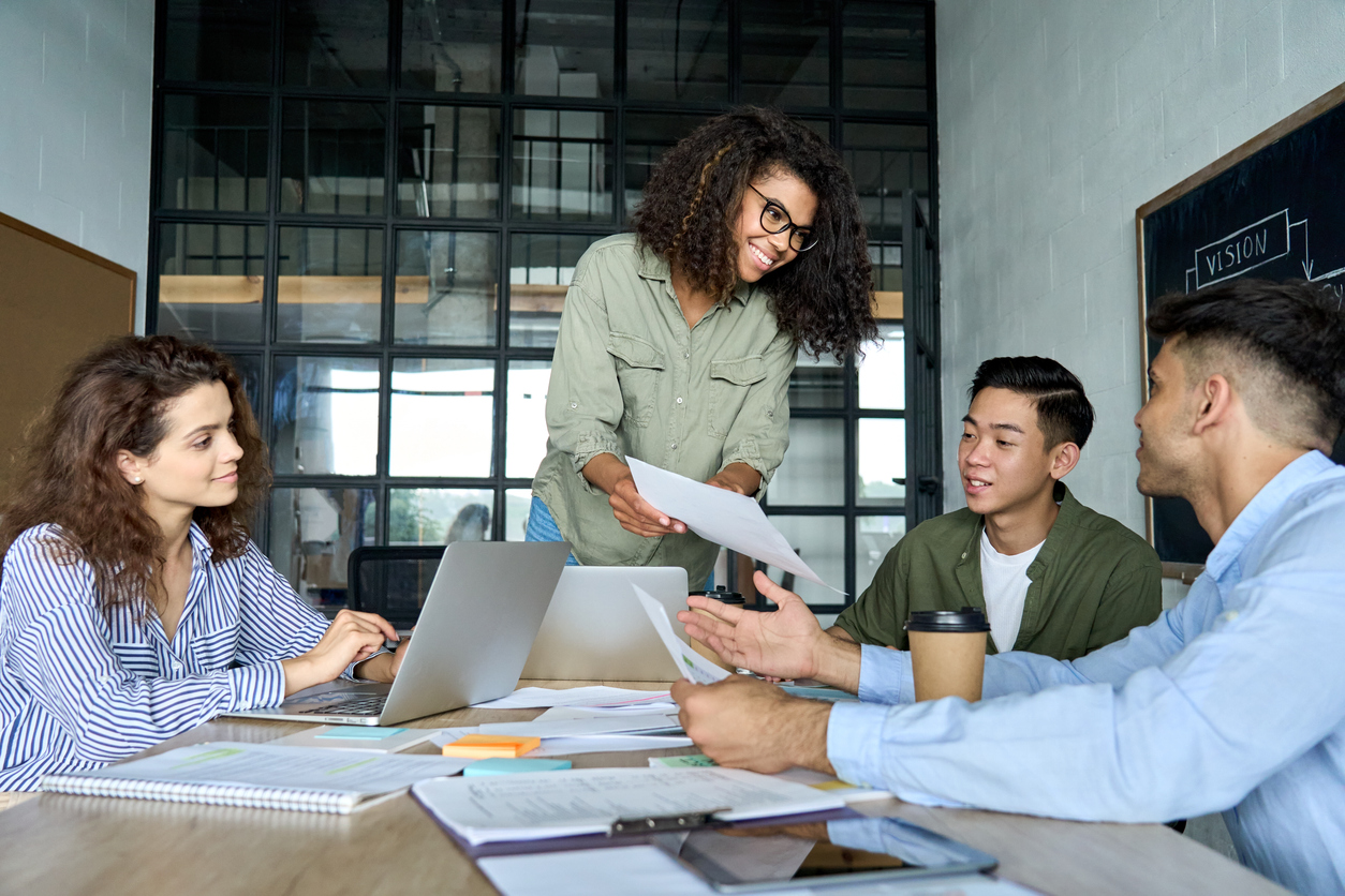 A diverse group of professionals collaborating around a table